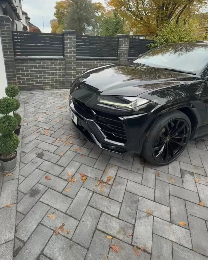 Black Lamborghini Urus on a driveway