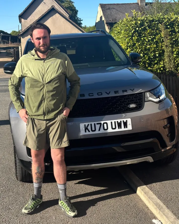 A customer with his new Land Rover Discovery