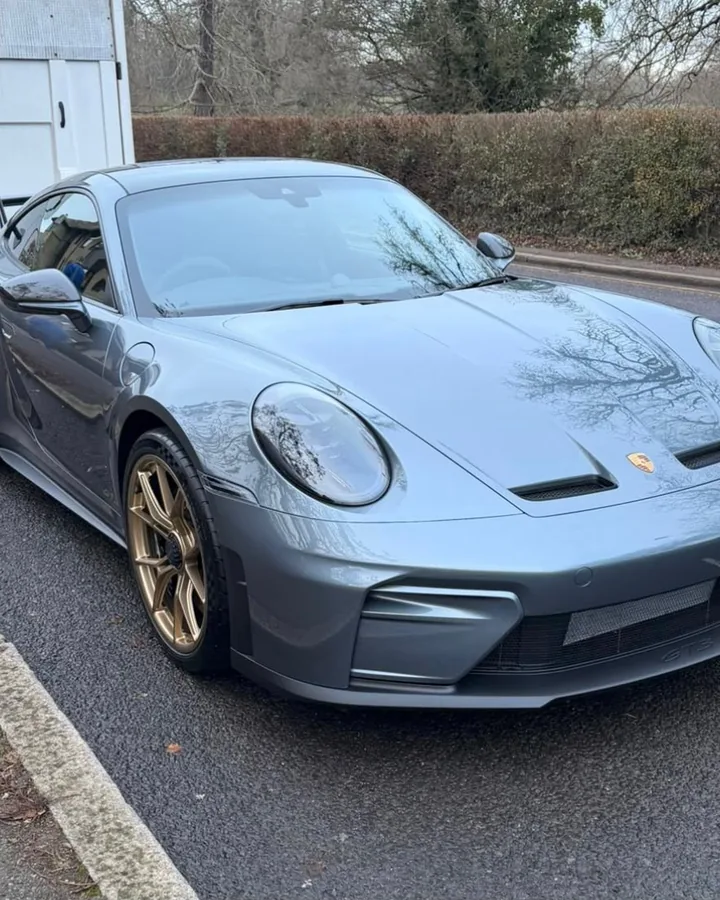 Grey Porsche 911 GT3 with gold wheels