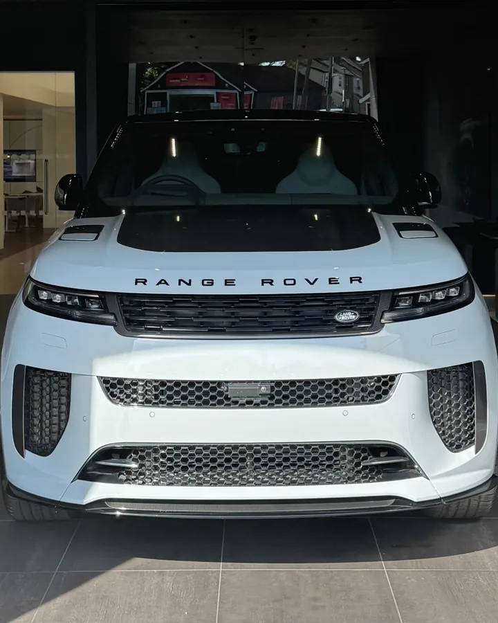 White Range Rover Sport SV in a showroom