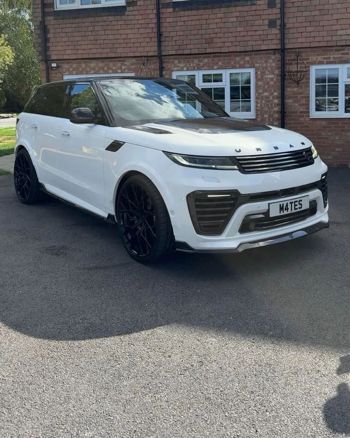 White Range Rover Sport outside a house